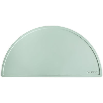 Silicone placemat in Cambridge Blue, featuring a half-circle shape and a textured surface, ideal for mealtime messes.