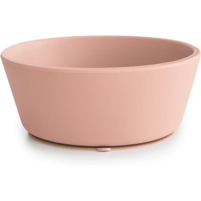 Mushie silicone suction bowl in blush, featuring a smooth exterior and a suction base for stable feeding.