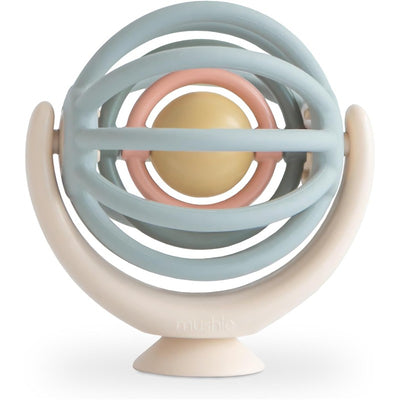 Suction Spinner Ball by Mushie, featuring a light blue and pastel pink frame with a beige central ball, designed for infants.