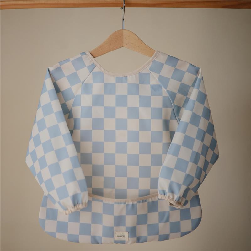 Water-resistant baby bib with adjustable long sleeves, featuring a blue and white checkered pattern.