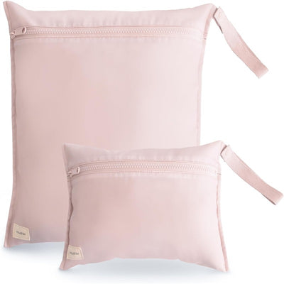 Water-resistant wet bags in blush, featuring two sizes with zippered closures and convenient handles.