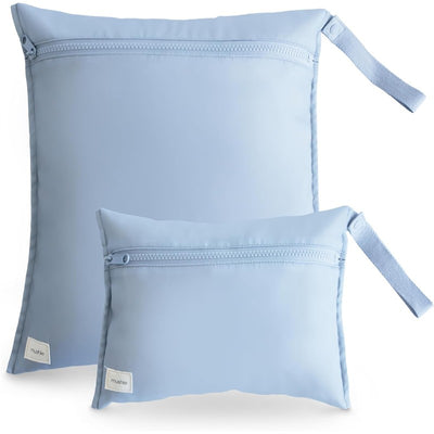 Two water-resistant wet bags in a soft light blue color, featuring zippers and handles, designed for storage.