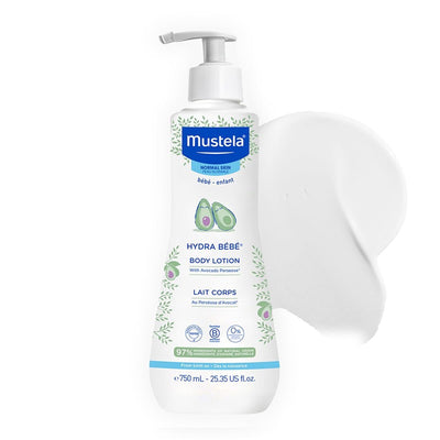 Mustela Hydra Bébé Body Lotion bottle with a smear of white cream on a white background