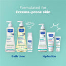Mustela Stelatopia product lineup for eczema-prone skin, featuring a cleansing gel and hydrating creams against a light blue background.