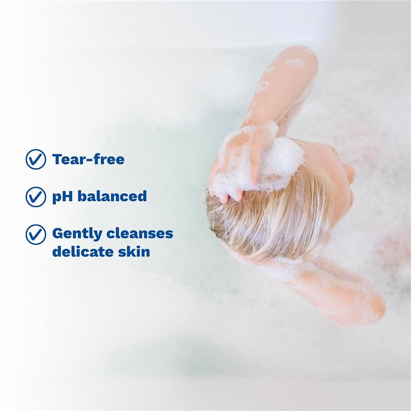 Mustela Stelatopia Foam Shampoo in use, featuring a child washing hair with foam, highlighting tear-free, pH balanced, and gentle cleansing benefits.