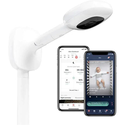 Nanit Pro Camera attached to a wall mount, with two smartphones displaying a baby monitoring app and live video.