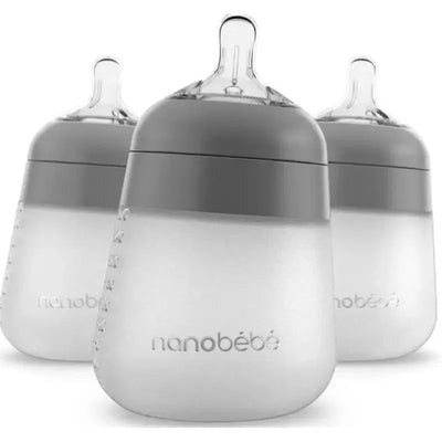 Three Nanobebe 9oz silicone baby bottles in gray, featuring a transparent base and gray caps, ideal for feeding infants.