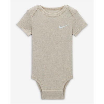 Light beige newborn bodysuit with short sleeves, featuring a small gray Nike logo on the front.