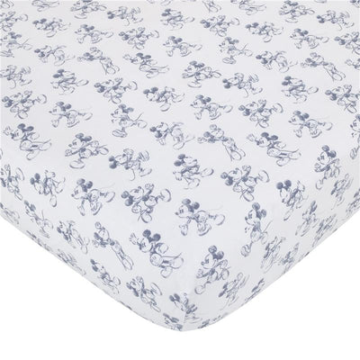 Crib bedding set featuring a white fabric with repeated blue sketch-style Mickey Mouse illustrations.