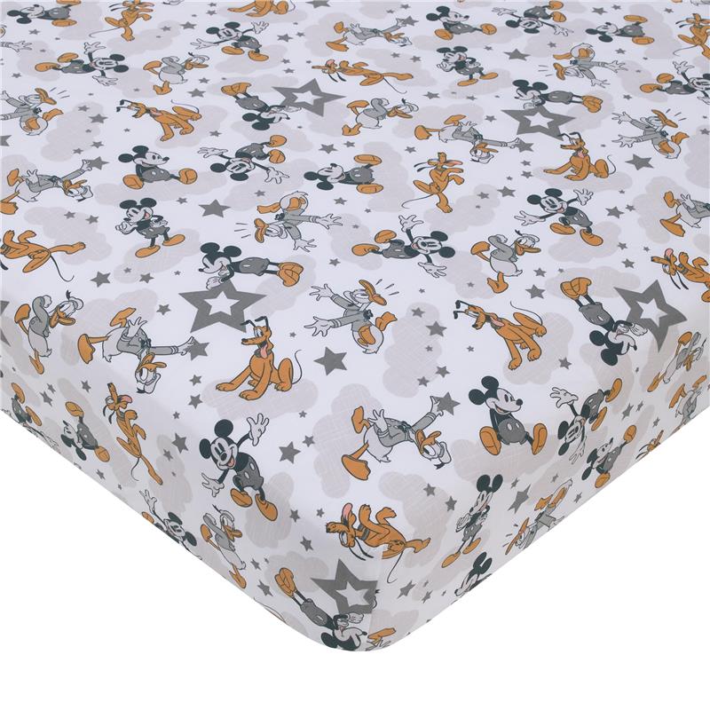 Disney Mickey Mouse patterned crib bedding set featuring playful designs of Mickey, Pluto, and stars.