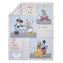Disney-themed mini crib bedding set featuring Mickey, Minnie, Donald, Goofy, and Pluto with playful text and colorful patterns.
