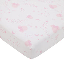 Crib sheet featuring a pink and white pattern with Minnie Mouse, stars, moons, and playful dots.