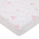 Crib sheet featuring a pink and white pattern with Minnie Mouse, stars, moons, and playful dots.