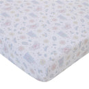 Light blue, pink, and white crib sheet with whimsical Cinderella-themed patterns, featuring castles, flowers, and magical items.
