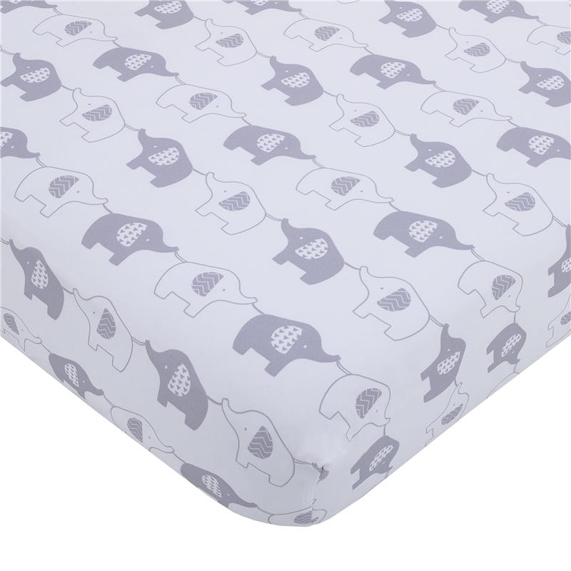 Mini crib bedding set featuring a playful design of gray and white elephants on a soft background.