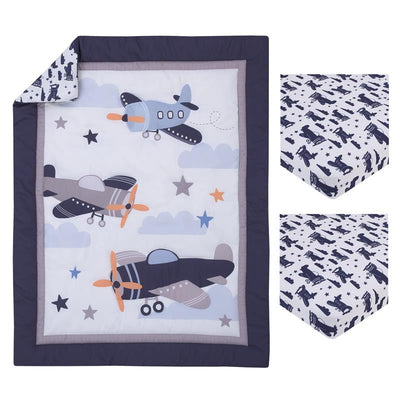 Mini crib bedding set featuring a quilt with plane designs and cloud patterns, plus two fitted crib sheets.