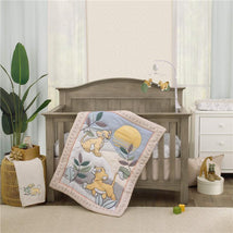 Lion King-themed nursery crib bedding set featuring a quilt with Simba designs, a mobile, and a cozy, stylish environment.