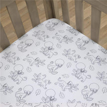 Super soft fitted crib sheet featuring Lion King characters and leafy designs, perfect for a nursery.