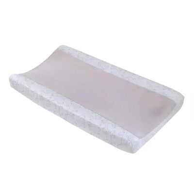 Changing pad cover featuring a subtle Lion King design, primarily white with light gray illustrations of characters.