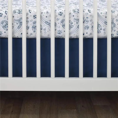 Fitted crib sheet featuring Disney Toy Story characters in a space theme, with navy blue accents and a white background.