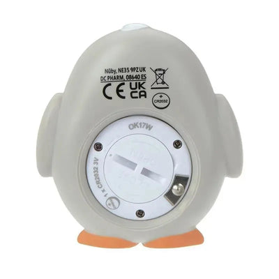 Baby bath thermometer shaped like a penguin, featuring a white bottom with a battery compartment and safety certifications.