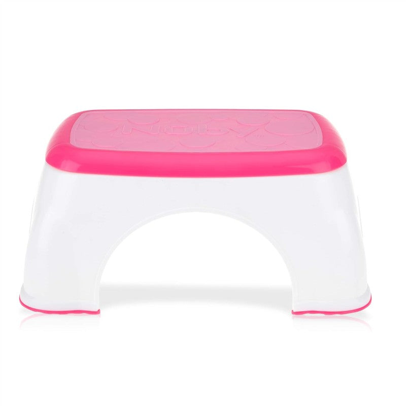 Nuby Step Up Stool in pink and white, designed for children to reach higher surfaces safely.