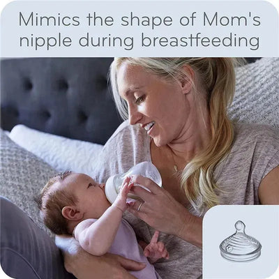Baby boy bottle gift set, featuring a mother feeding her infant a Nuk bottle designed to mimic breastfeeding.