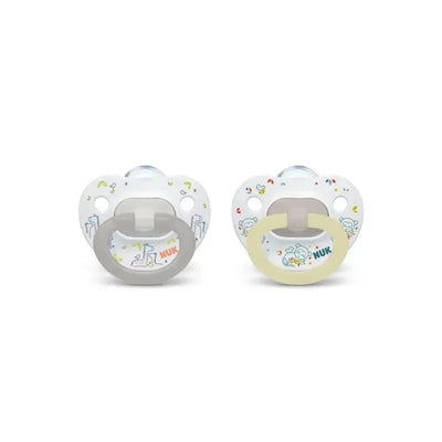Two Nuk fashion pacifiers in mixed colors - one with a gray handle and the other with a yellow handle, featuring playful designs.