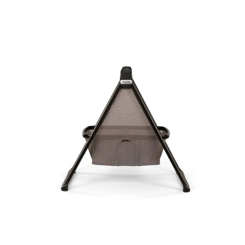 Nuna bassinet with a mesh canopy and a gray fabric base, designed to securely hold infants during rest.