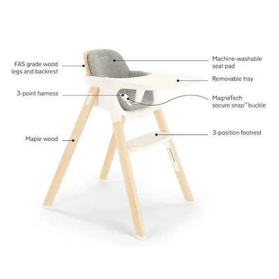 Nuna BRYN High Chair in Heritage design features FAS grade wood, a machine-washable seat pad, removable tray, and adjustable footrest.