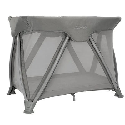 Nuna COVE™ aire go Travel Crib in Frost color, featuring a lightweight design with mesh sides for visibility and ventilation.