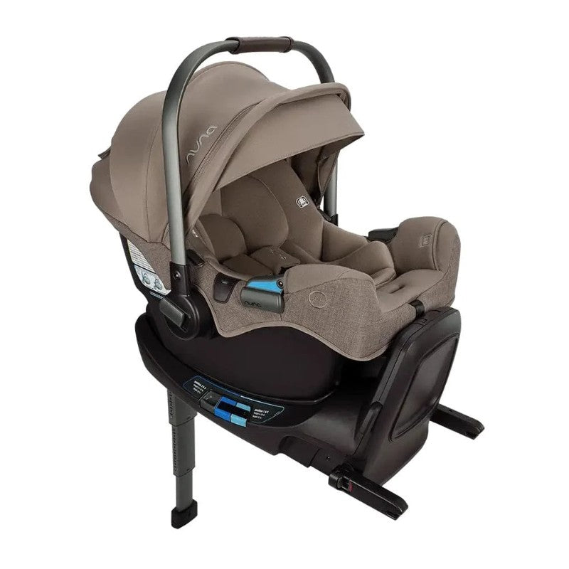 Nuna Flex System Frame with Pipa Rx infant car seat in Cedar color, featuring a padded interior and adjustable handle.
