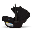 Nuna Pipa Aire Rx Infant Car Seat in Caviar/Chocolate, featuring an adjustable canopy and safety labels on the side.