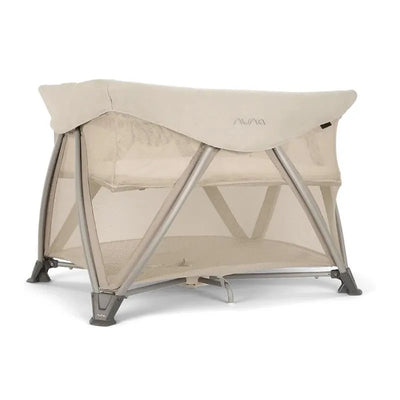 Nuna SENA™ aire Playard in Biscotti color, featuring a breathable mesh design and zip-off bassinet and changer.