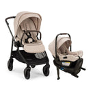 Nuna Swiv + Pipa Aire Rx Travel System in Biscotti, featuring a beige stroller with a reclining seat and a detachable infant car seat.