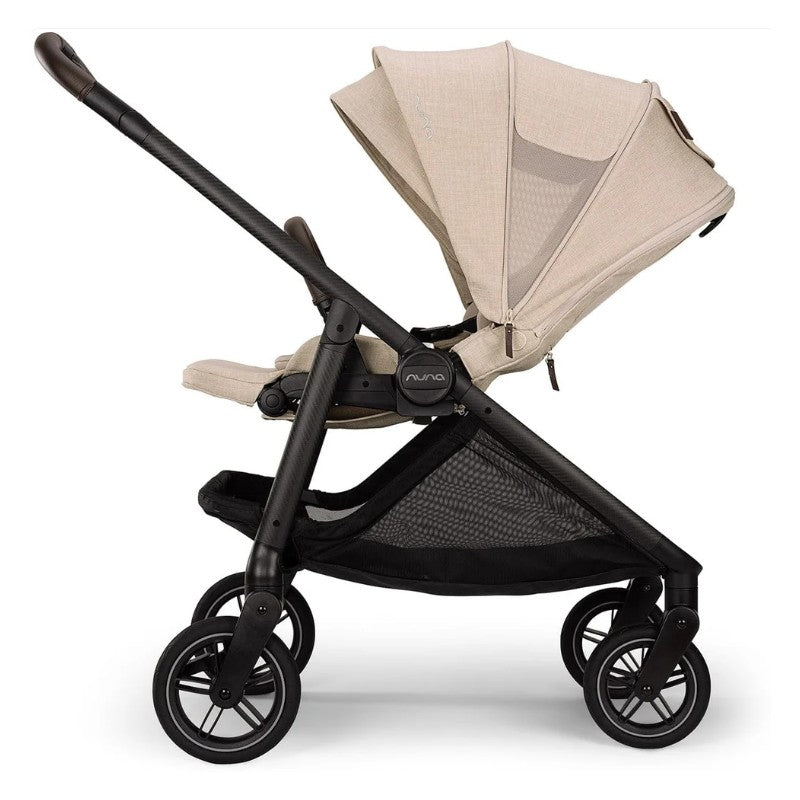 Nuna Swiv + Pipa Aire Rx Travel System in Biscotti color, featuring a sleek stroller with a large canopy and mesh storage.