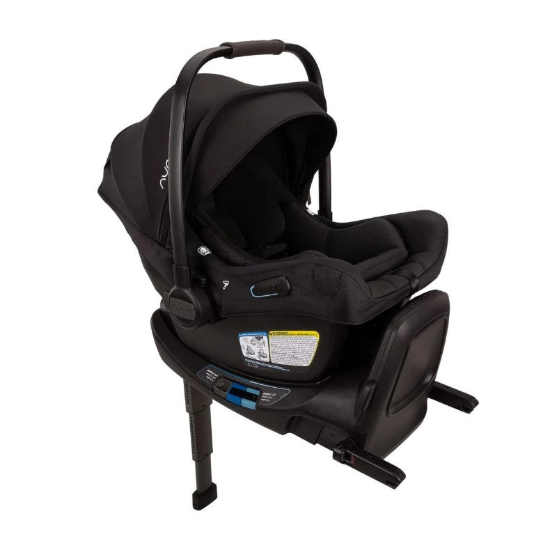 Nuna Pipa Aire Rx infant car seat in black, featuring a sleek design with safety labels and easy-install base.