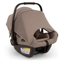 Travel system car seat in cedar color with a large canopy and safety harness, designed for infants.