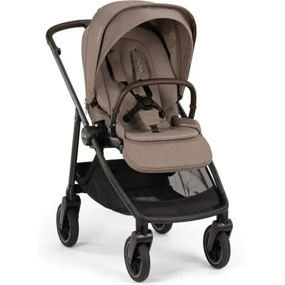 Nuna SWIV™ Stroller in Cedar color with a padded seat, adjustable canopy, and mesh storage basket.
