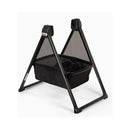 Nuna Swiv bassinet stand with a black fabric base and mesh sides, designed for a secure infant sleep environment.