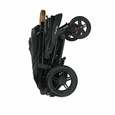 Nuna TAVO™ next stroller in Caviar color, shown in a folded position with a sleek design and black fabric.