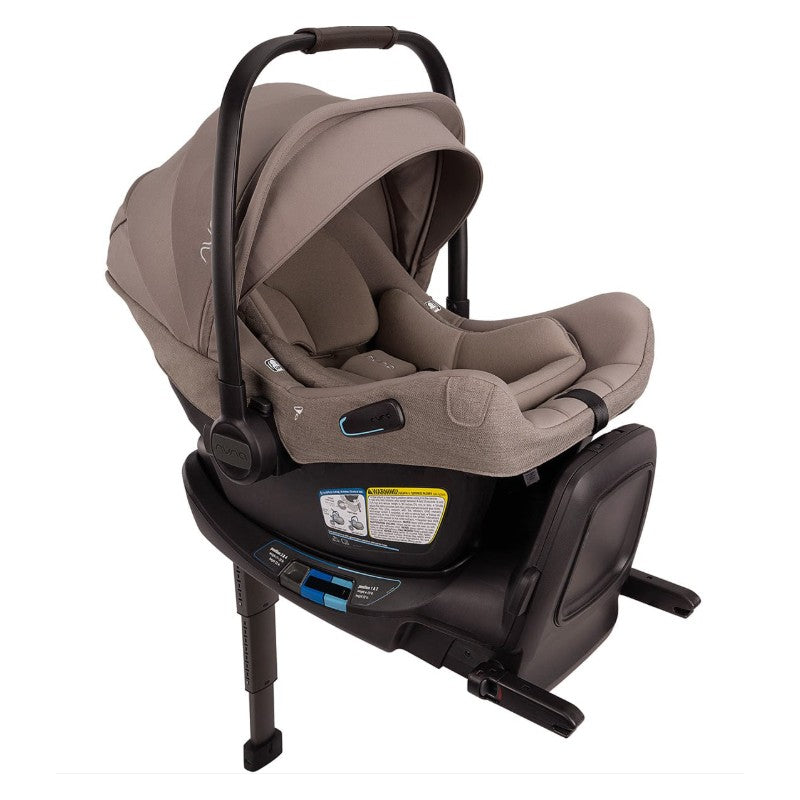 Nuna Triv Lx + Pipa Aire Rx Travel System in Cedar, featuring a lightweight car seat with a removable infant insert and adjustable canopy.