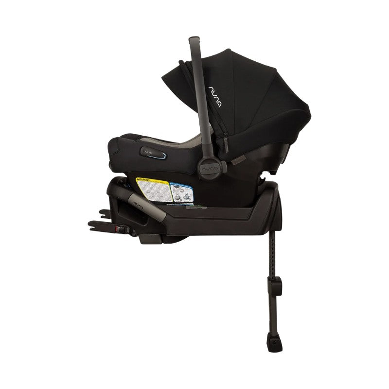 Nuna Triv Lx +Pipa Aire travel system bundle in Caviar color, featuring an infant car seat and base with safety labels.