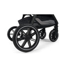 Nuna Triv Lx stroller wheels in black, featuring a sleek design with five spokes and a smooth tread.