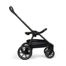 Nuna Triv Lx stroller in caviar color, featuring a sleek design and adjustable handle, shown from the side.