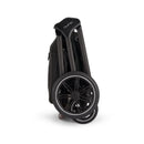 Nuna Triv Lx stroller folded with wheels visible, designed for portability and convenience in a Caviar color.
