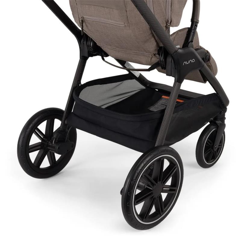 Nuna Triv LX stroller with a spacious black storage basket and sleek, modern wheels, designed for convenience and style.