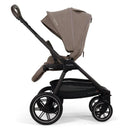 Nuna Triv Lx stroller in Cedar color, featuring a brown fabric seat, adjustable canopy, and a spacious storage basket.