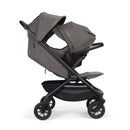 Nuna Trvl 360 Compact Stroller in Pewter, featuring a sleek design, large canopy, and adjustable seat for infant use.