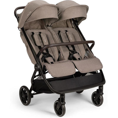 Lightweight side-by-side double stroller by Nuna in cedar color, featuring two seats, canopies, and a black frame.
